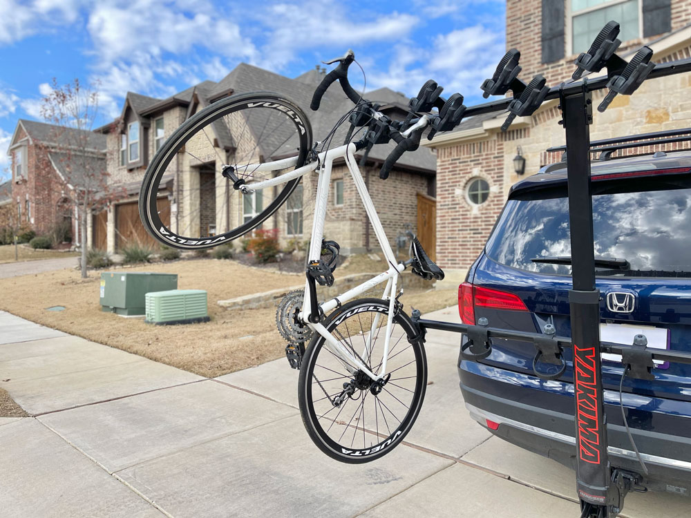 Road bike with dropper bars hanging from the Yakima HangTight 6 vertical bike rack