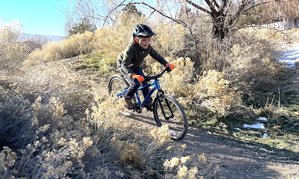 riding the Prevelo alpha four 24 inch kids bikes