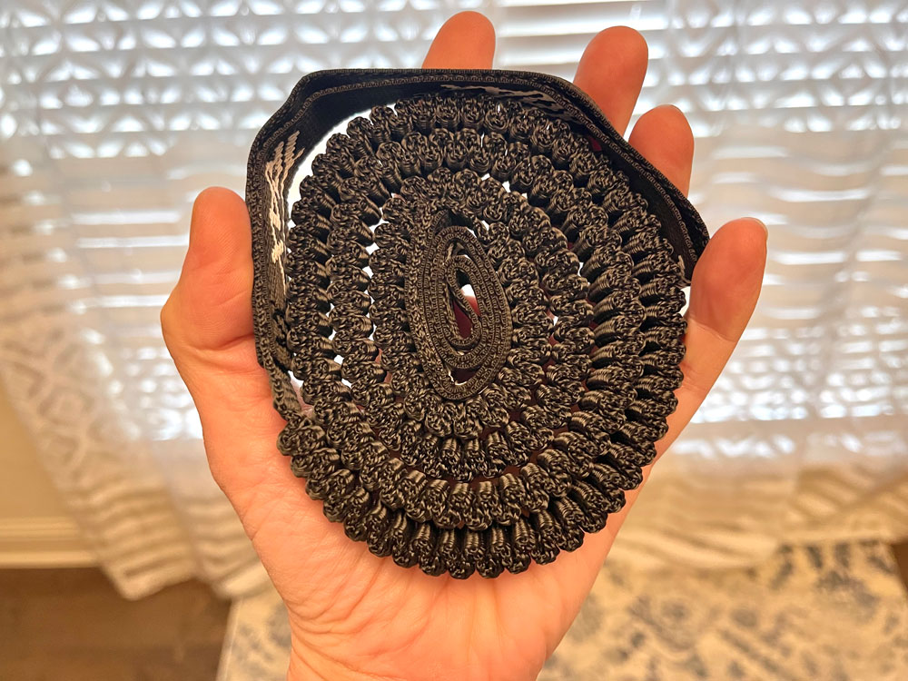 TRAX FLEX tow rope coiled up in a woman's hand