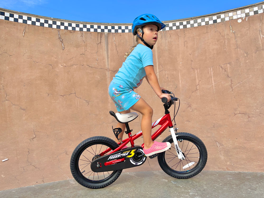 4 year old riding standing up on the Royalbaby Freestyle 16 inch bike