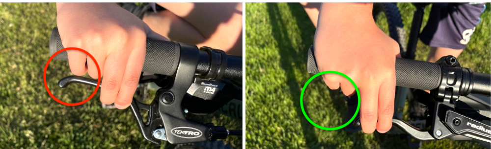 a childs hand pulling on the brake levers on the Commencal Ramones 24 and the Prevelo Zulu