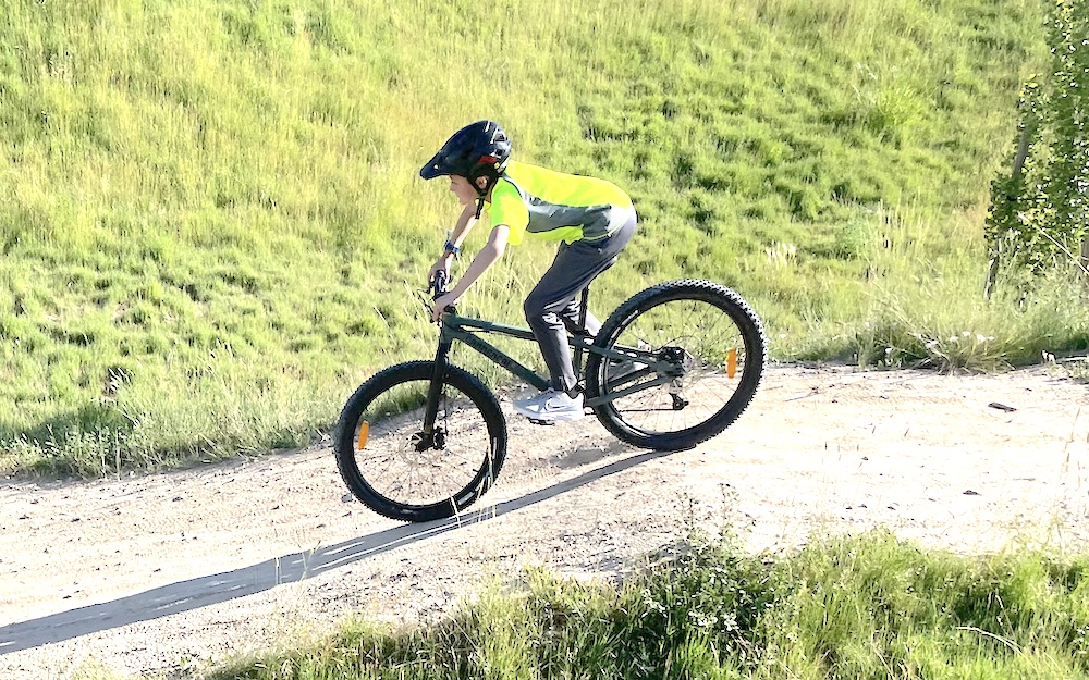 10 year old riding a dirt trail on the Commencal Ramones 24