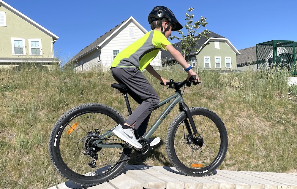 Boy riding Ramones 24 over wood roller