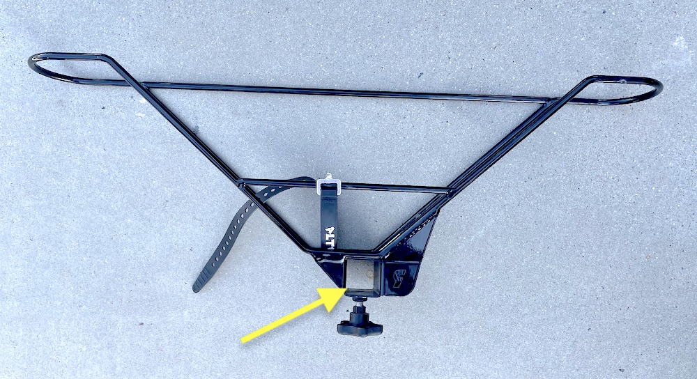 Alta bike rack wheel basket, pointing to mounting bracket on basket