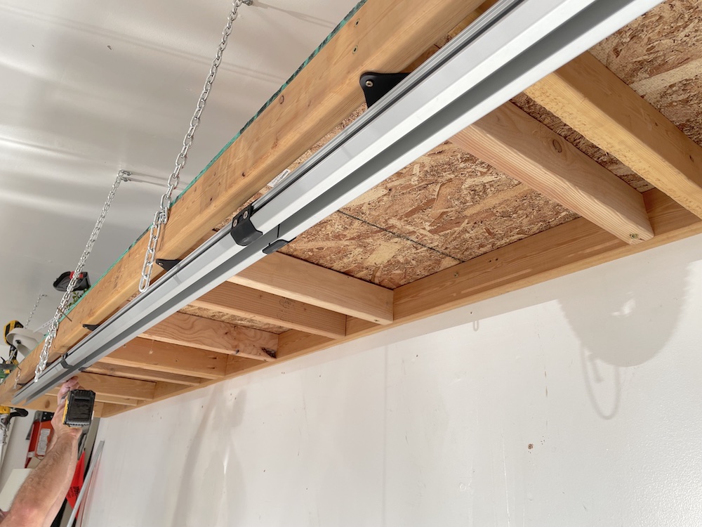 SpaceRail system attached beneath a floating shelf