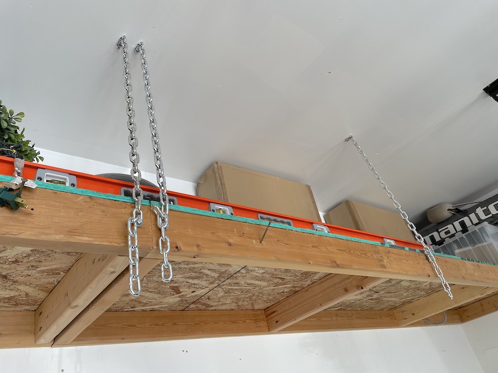 DIY Floating shelf supported with chains to ceiling rafters