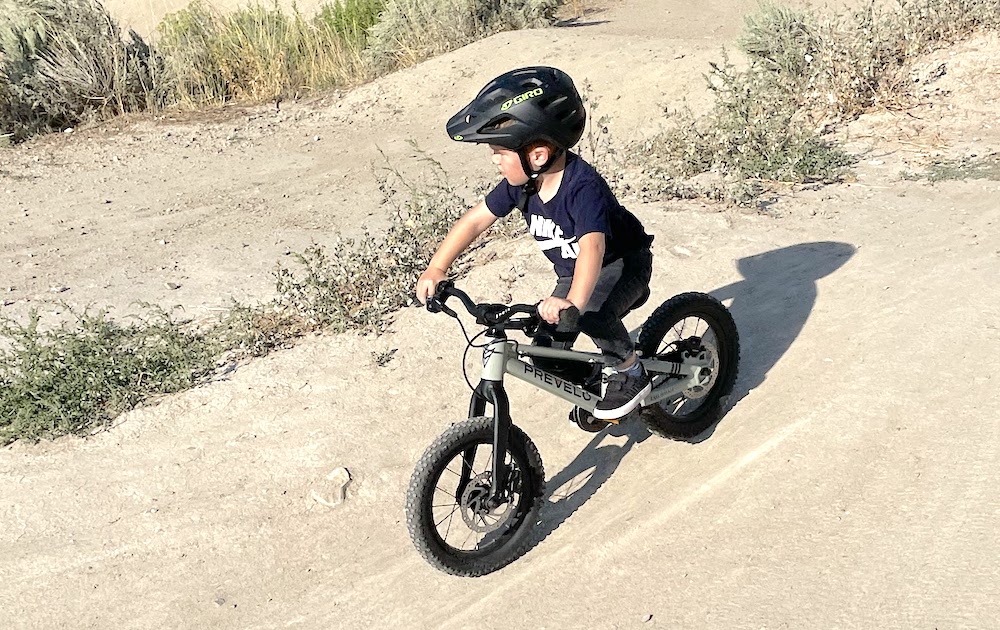 3 year old riding Prevelo Zulu One on a dirt trail