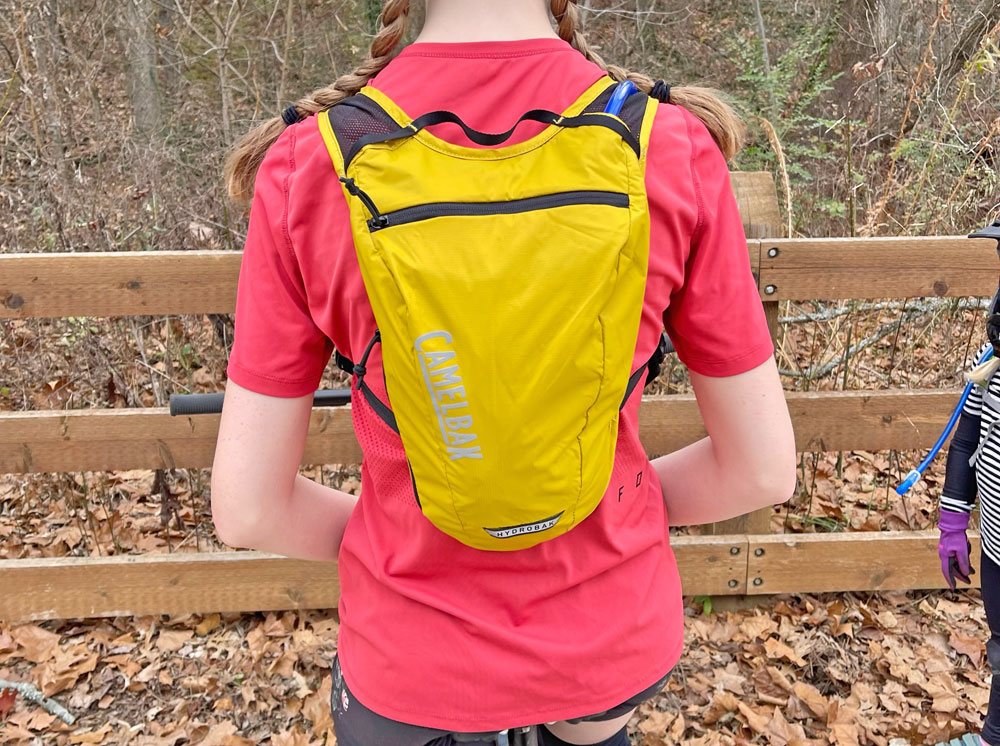 Teenage girl wearing Camelbak Hydrobak Light hydration pack