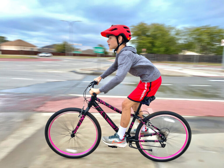 Child speeding down hill on Guardian 26 inch bike