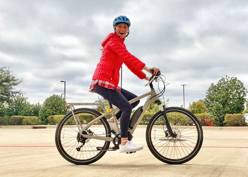Woman riding REI Co-Op Cycles ebike