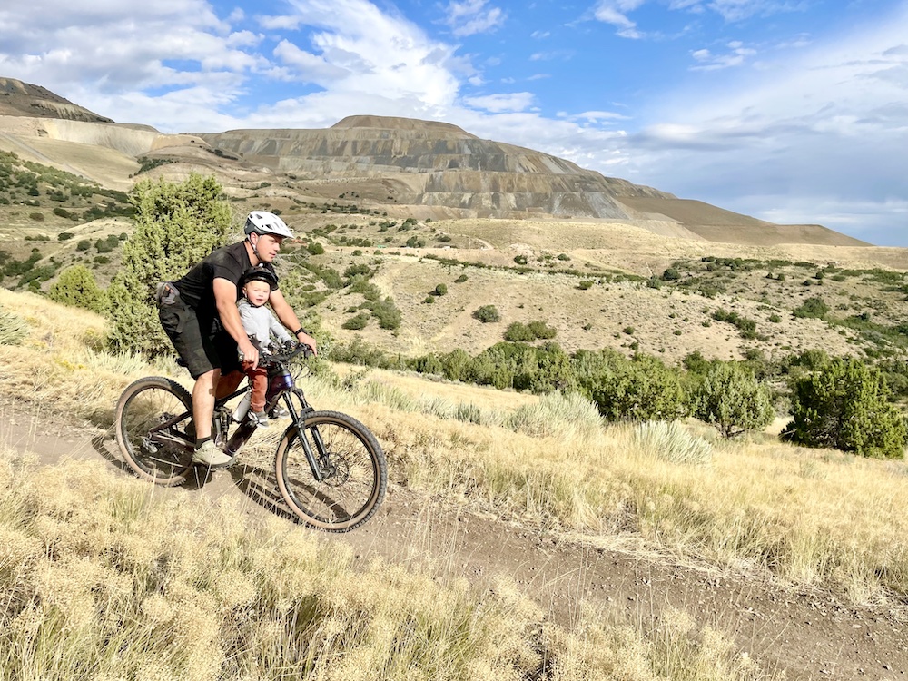 dad and son riding on the kids ride shotgun seat