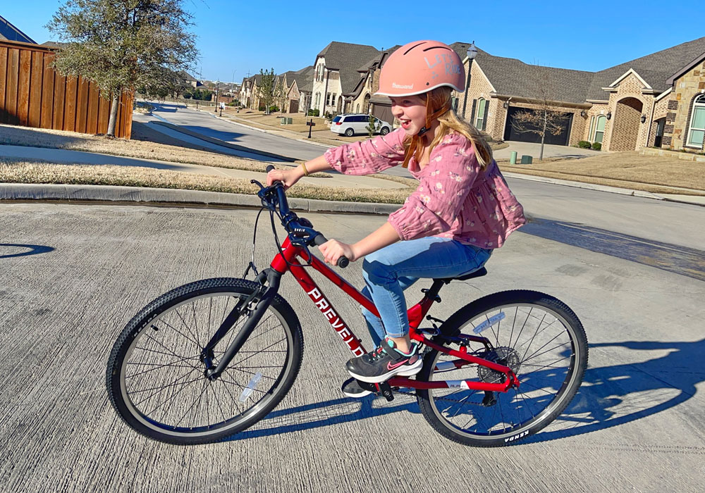Rider leaning into turn on Prevelo Alpha Four