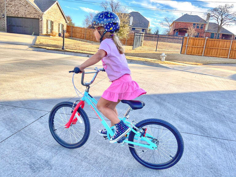 Girl riding Retrospec Koda 2 Plus single speed in the street