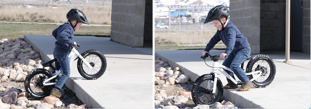 boy lifting up the Dirt Hero balance bike and then putting it down a drop