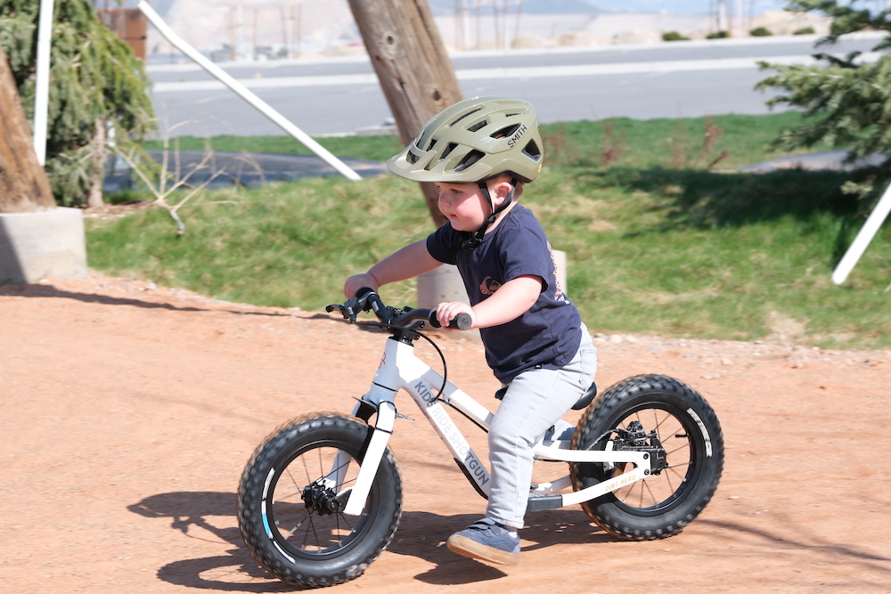 toddler on the kids ride shotgun balance bike