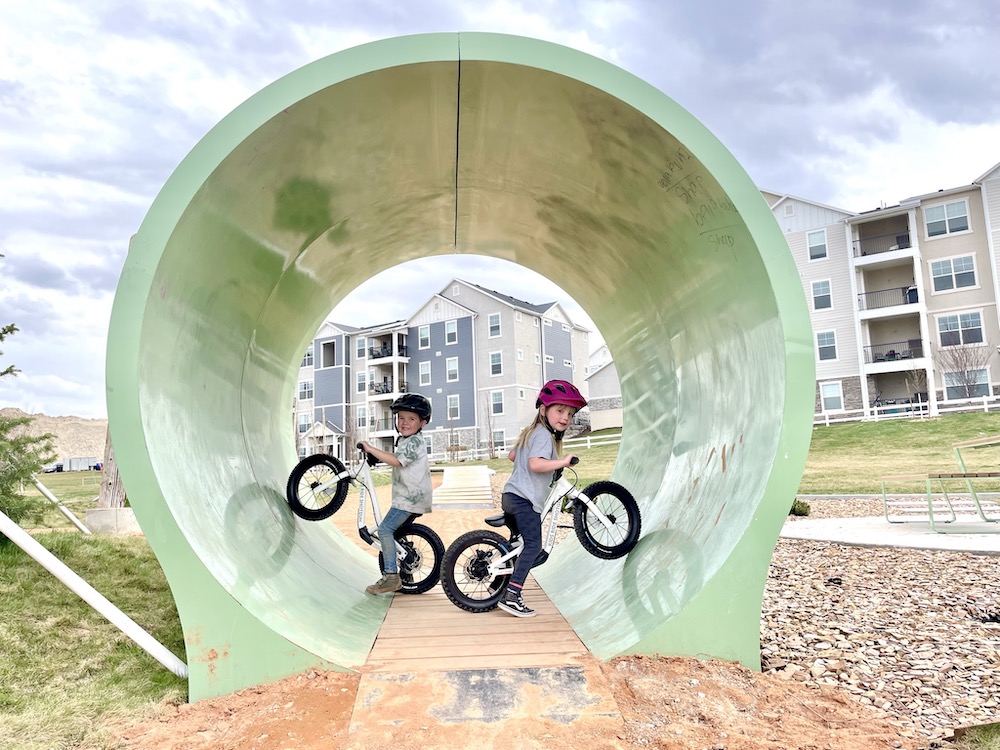boy and girl having fun on their DIrt Hero balance bikes