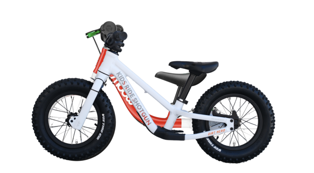 woom 1 balance bike overlap over the Dirt Hero 12 wheels
