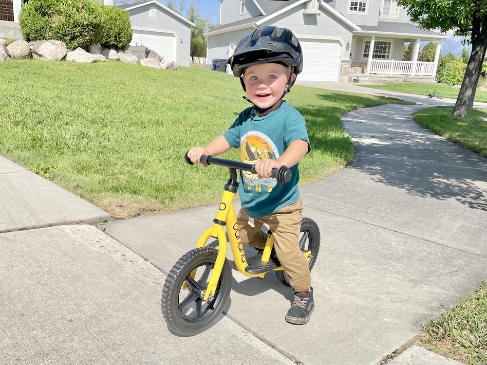 Young boy walking the banana bike LTR balance bike