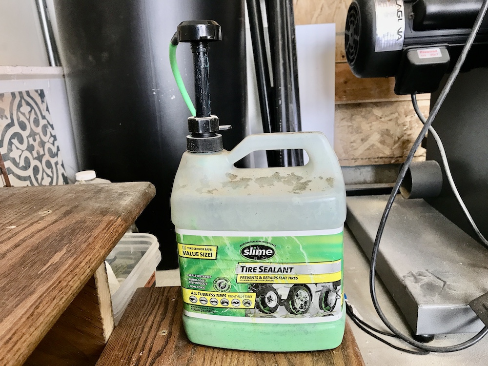 Gallon bottle of green Slime Tire sealant