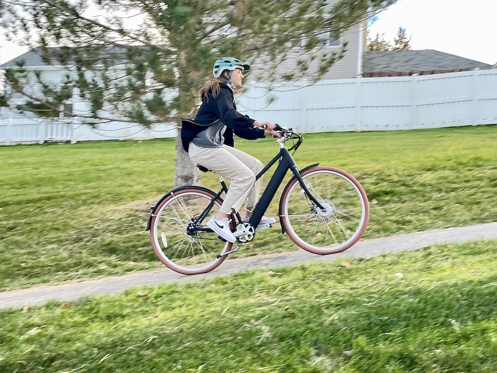 women riding the eclassic plus up a hill