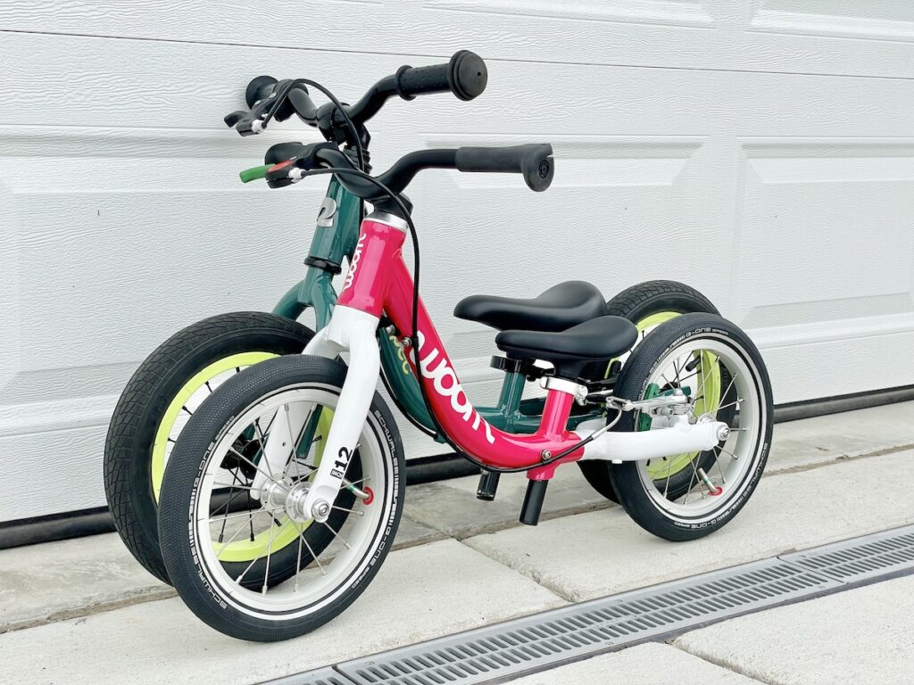 woom GO 1 next to the retrospec cub plus 12 inch balance bike