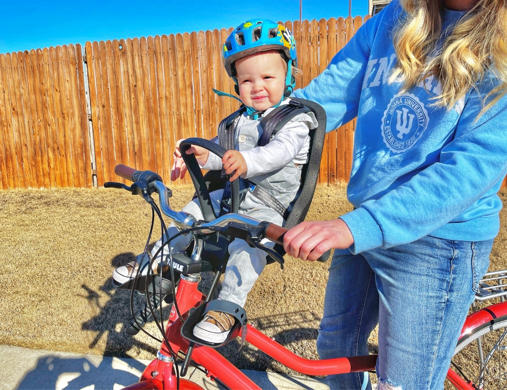 12 month old baby sitting in Thule Yepp Nexxt 2 mini baby bike seat