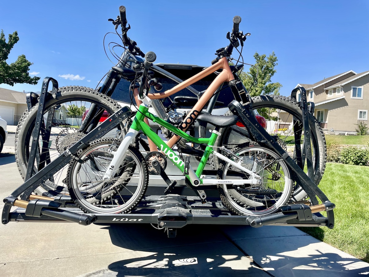 Kuat Piston Pro bike rack loaded with a 16 inch kids bike