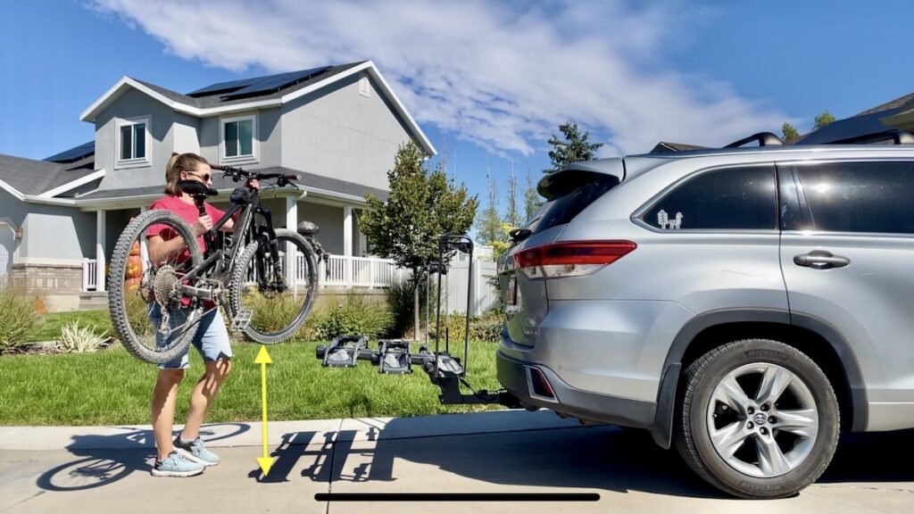 loading a bike on the kuat piston pro bike rack