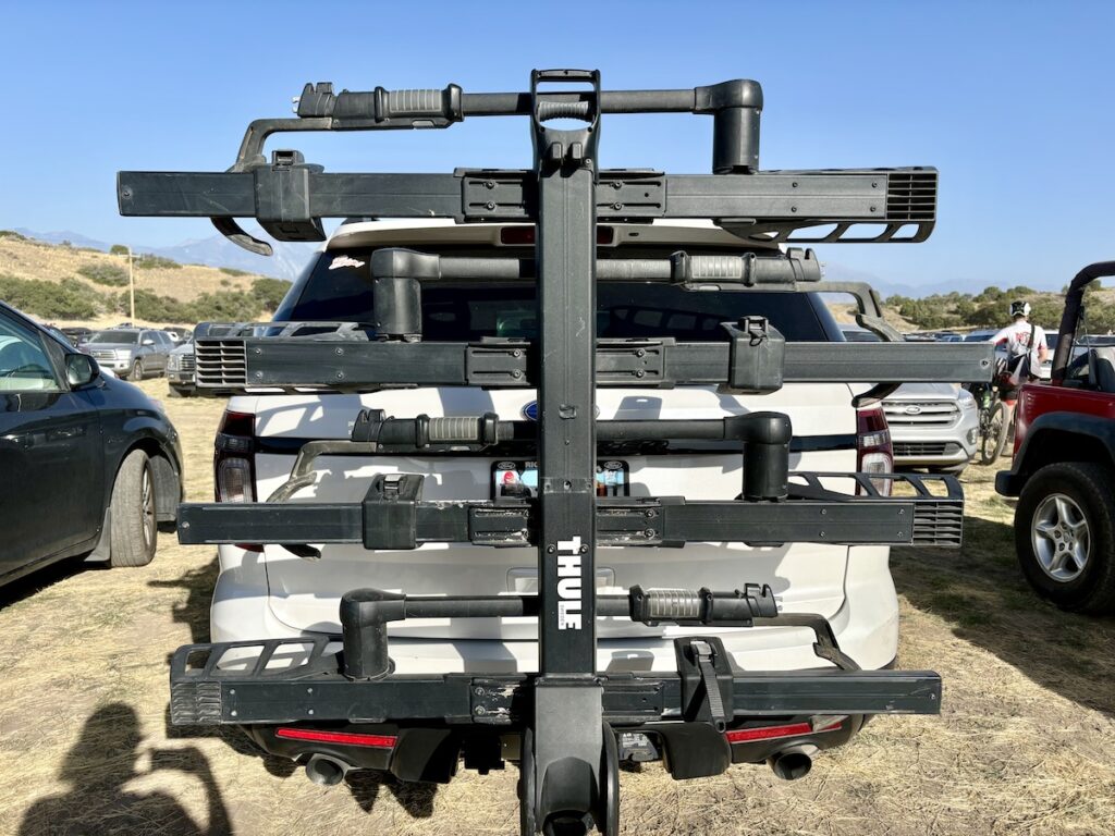 4 capacity thule t2 pro folded up on a suv, blocking the window
