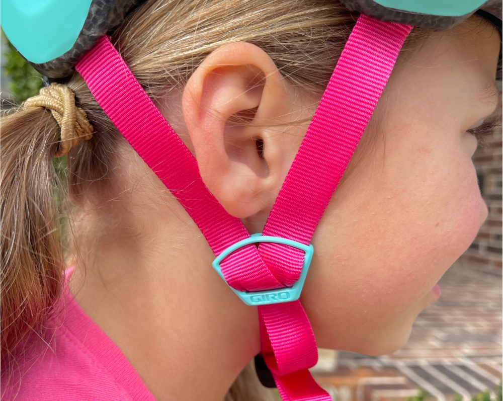 Helmet side strap adjusted to a V underneath the ear