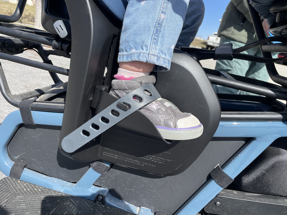 Foot rest and foot strap secure a toddler's foot in the Yepp 2 rear child bike seat