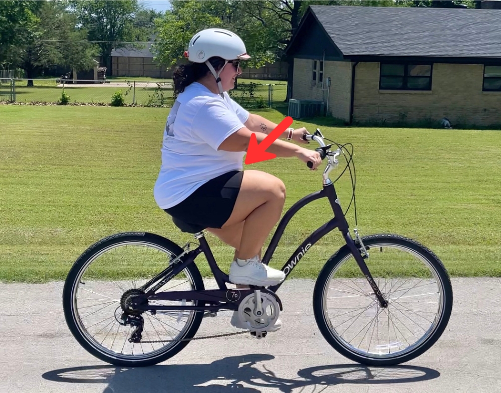 Plus sized rider on Electra Townie 7D, showing that she has more room to pedal on the high stroke