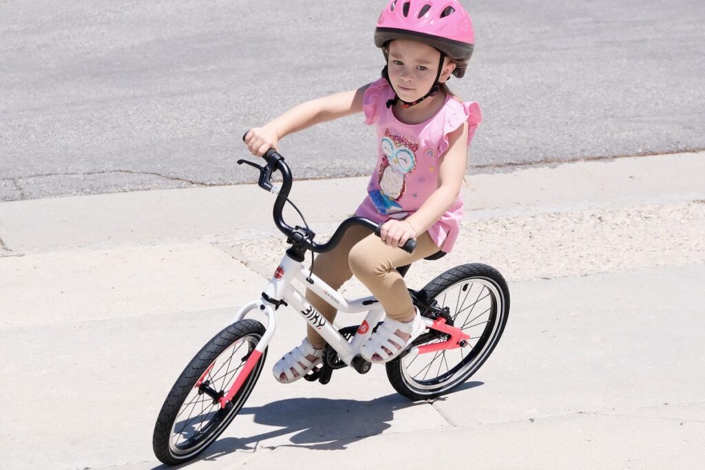 Young Rider turning on the Biky 16 kids bike