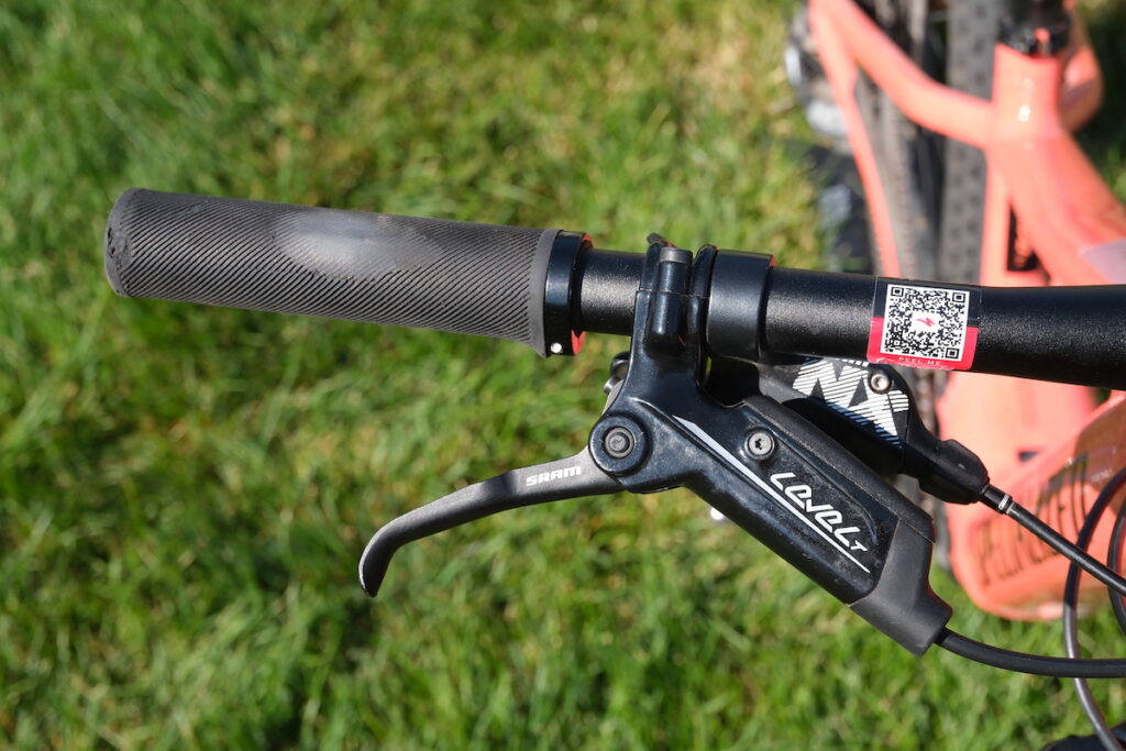 SRAM Level T brake lever on a bike with a worn grip