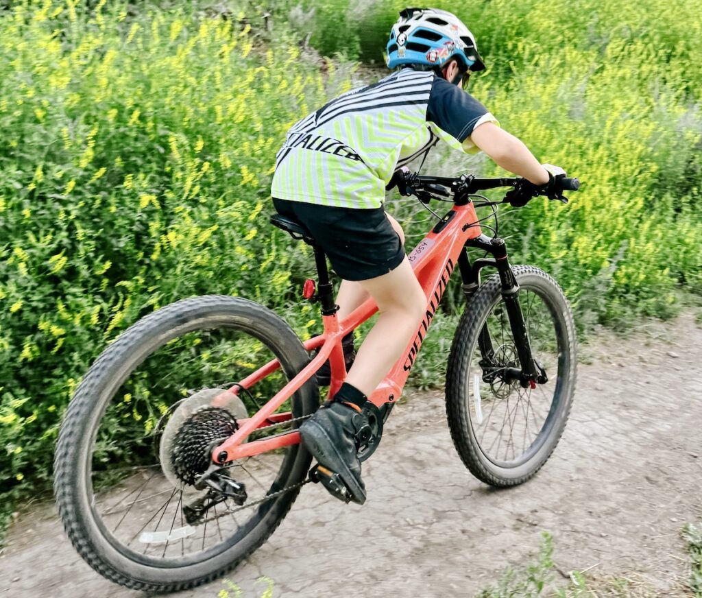 young mountain biker riding the specialized turbo levo kids