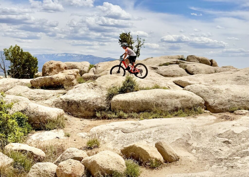 9 year old mountain biking over rocks
