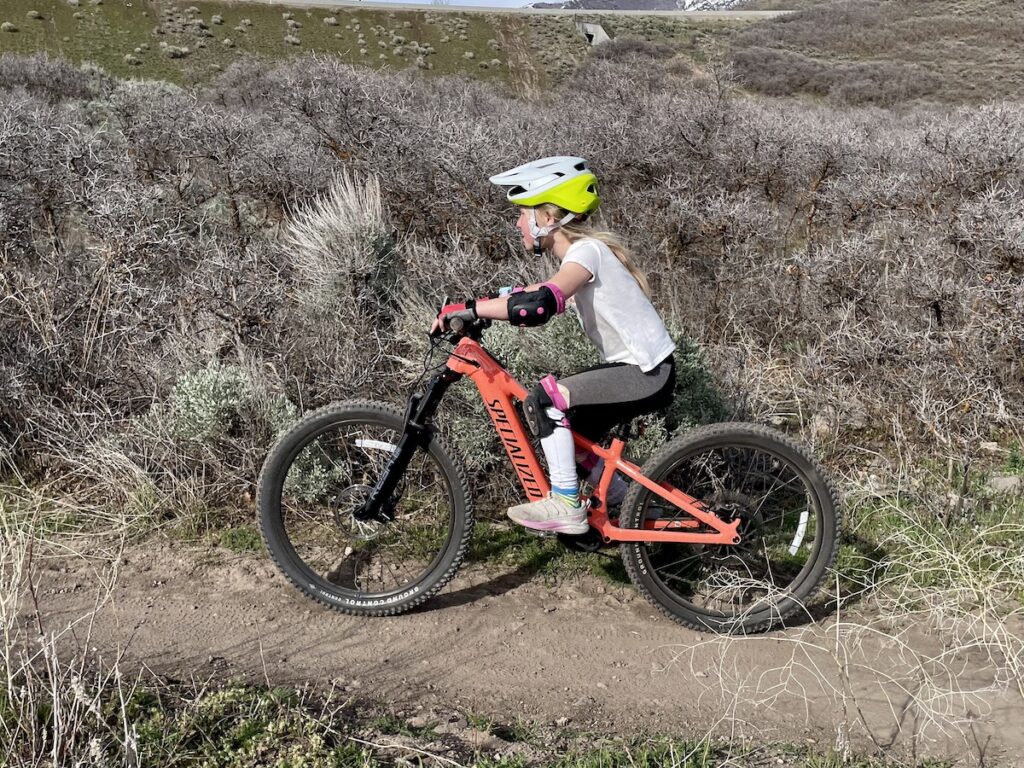 girl riding the specialized ebike for kids
