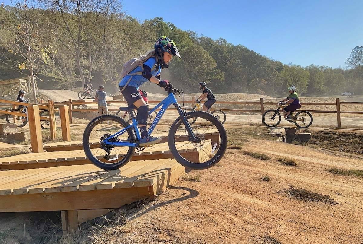 Child riding over rock slab on Prevelo Zulu Three