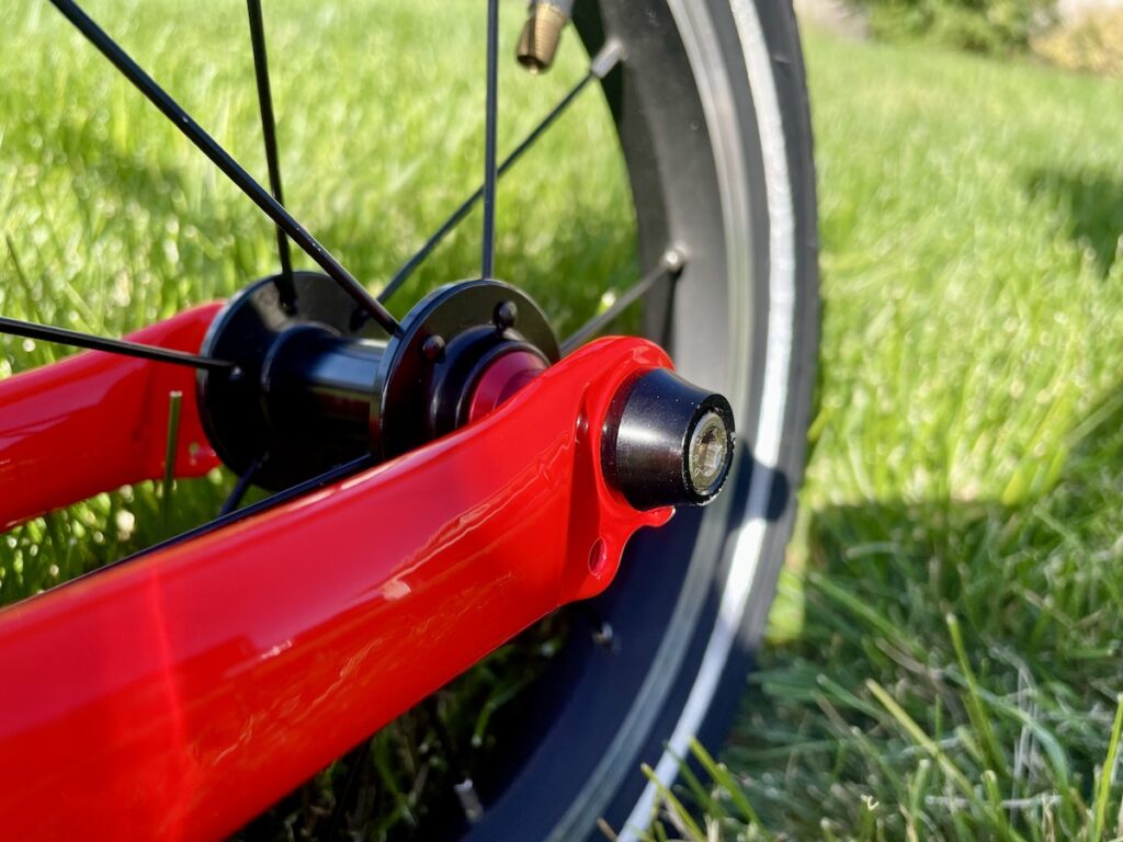 covered axle bolts on a balance bike