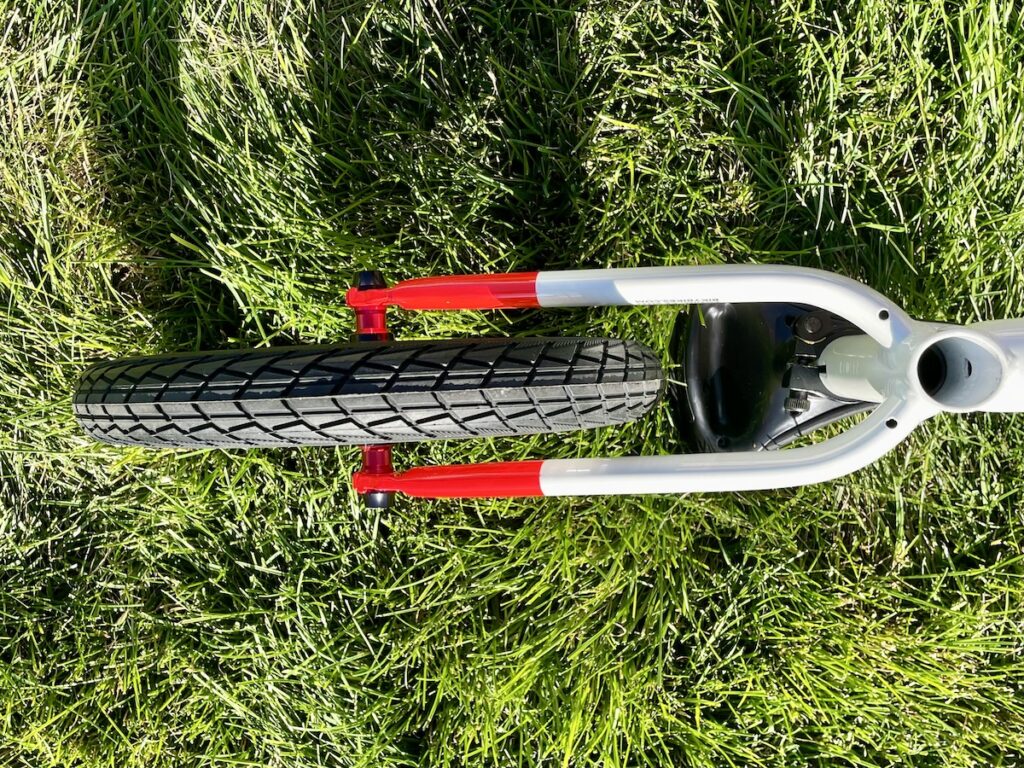 a view of the rear wheel and axle of the biky 12 balance bike form the bottom side showing how narrow the bike is