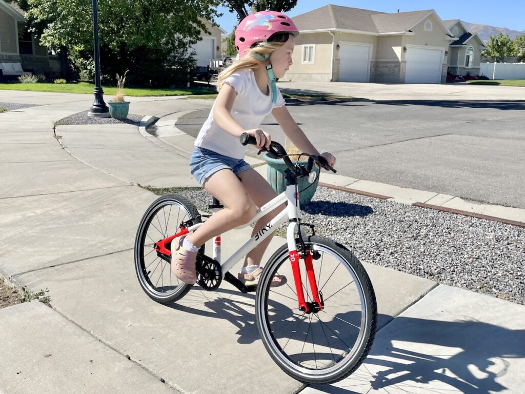 young girl riding the biky 20 pedal bike