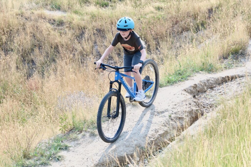 riding a single-track trail on the Prevelo 26" mountain bike