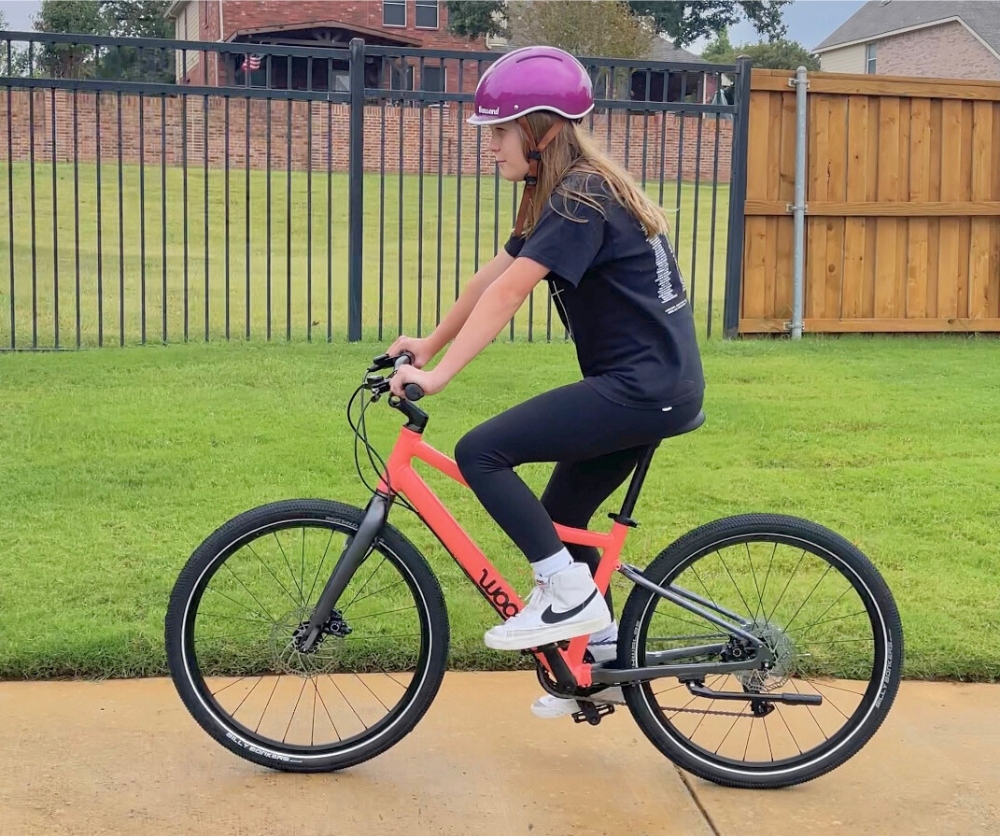 12 year old rider on woom EXPLORE 5 with seat height maxed out