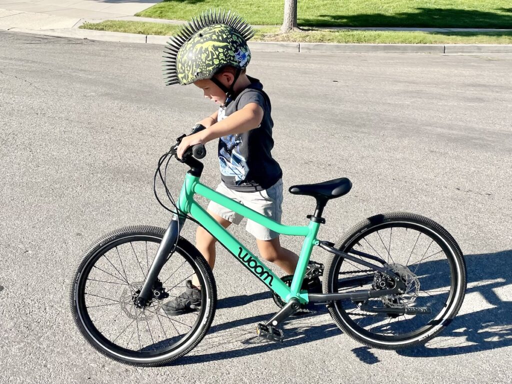 walking and activating brake levers on the explore woom 4