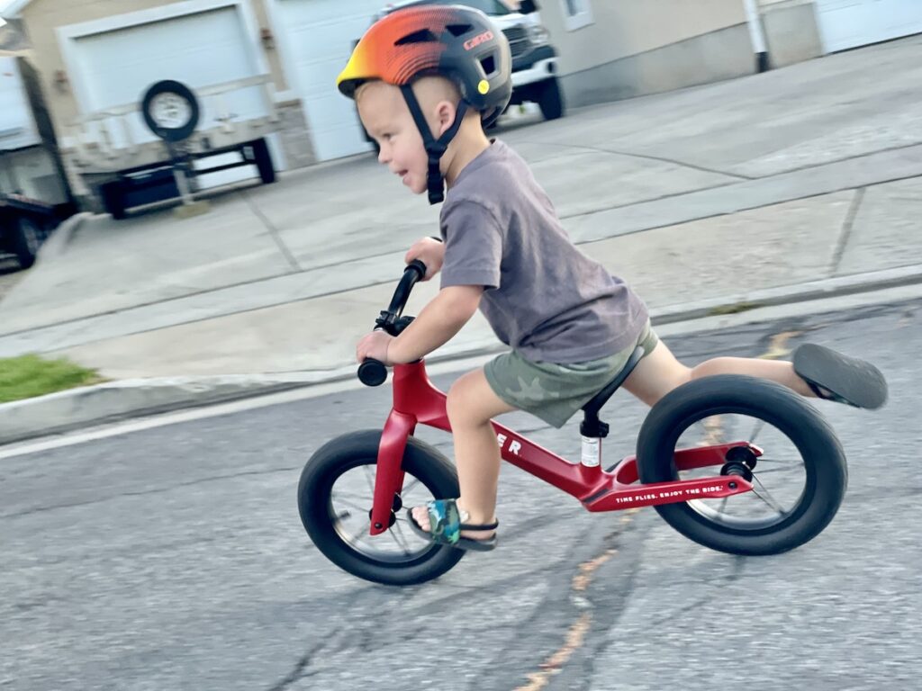 Child riding aggressively on the Radio Flyer Ultra Lite balance bike