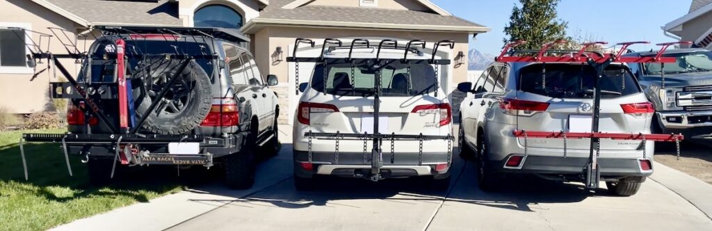 Alta Superior, Thule ReVert and VelociRAX 5x vertical bike racks lined up next to each other