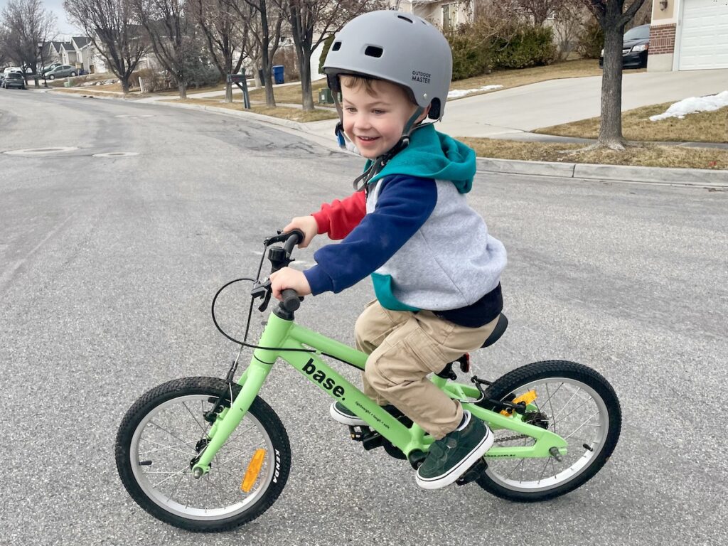 young child riding the base bikes 16 inch bike