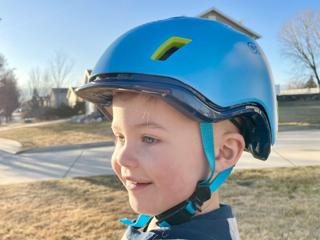 toddler wearing the Ozmo Sidekick ebike helmet for kids