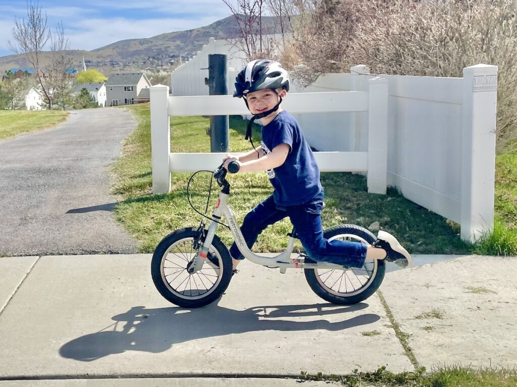 preschooler running on the retrospec cub plus XL balance bike