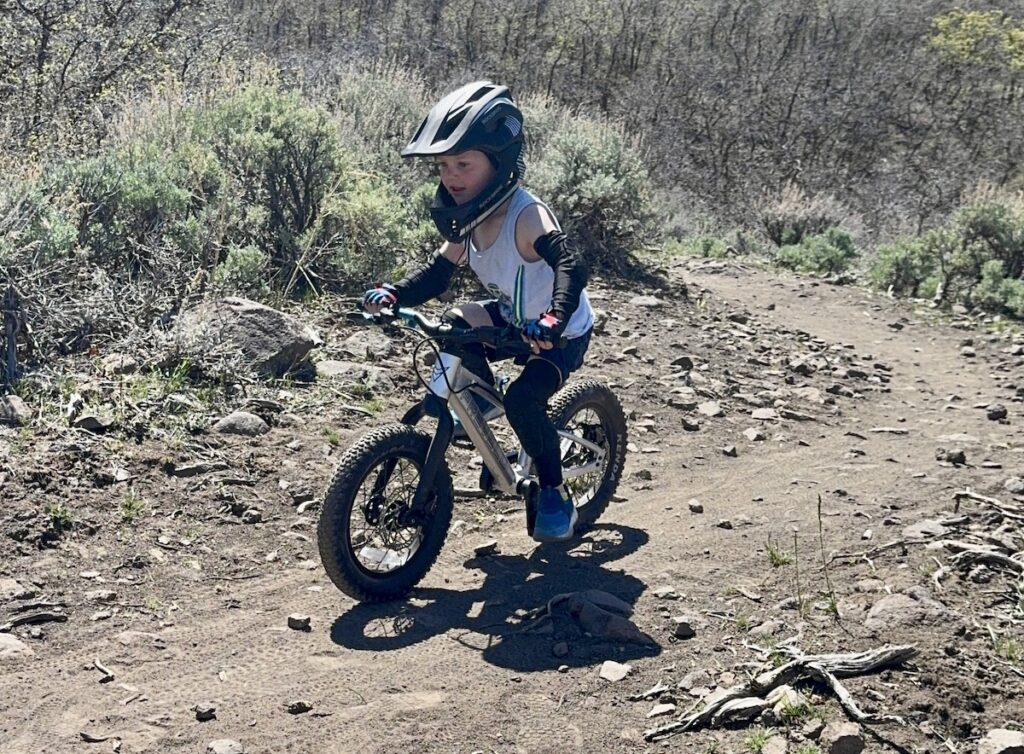 Prevelo Alpha One 14 inch in pedal bike mode on a trail